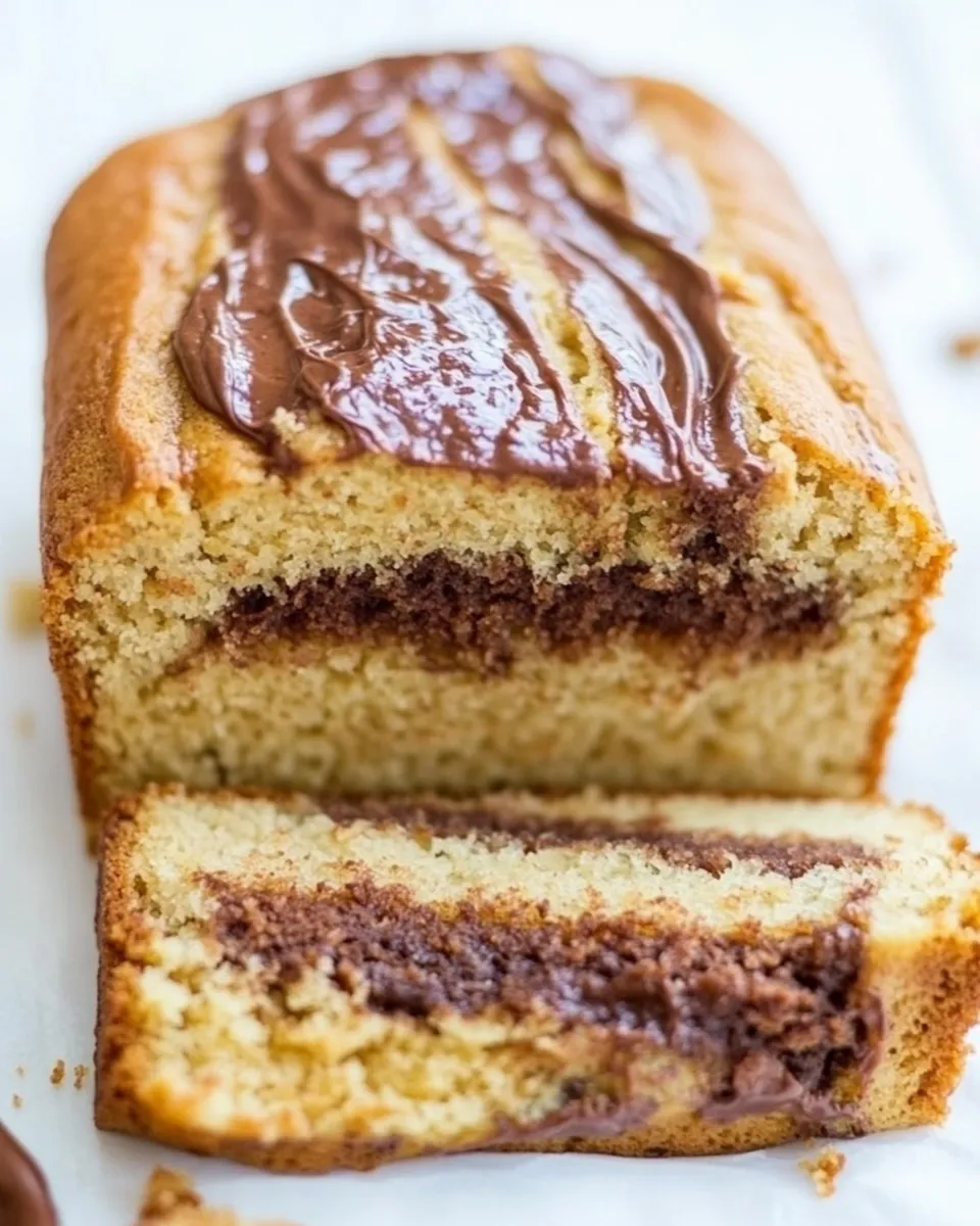 Delicious Nutella-Layered-and-Swirled Peanut Butter Bread Peanut Butter Loaf Cake shot