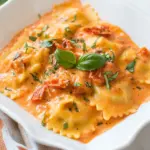 Homemade Ravioli with Creamy Sun-dried Tomato and Basil Sauce photo