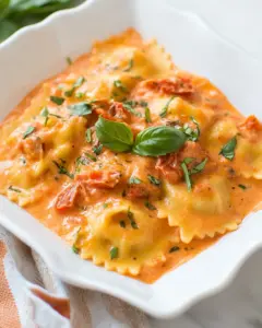 Homemade Ravioli with Creamy Sun-dried Tomato and Basil Sauce photo